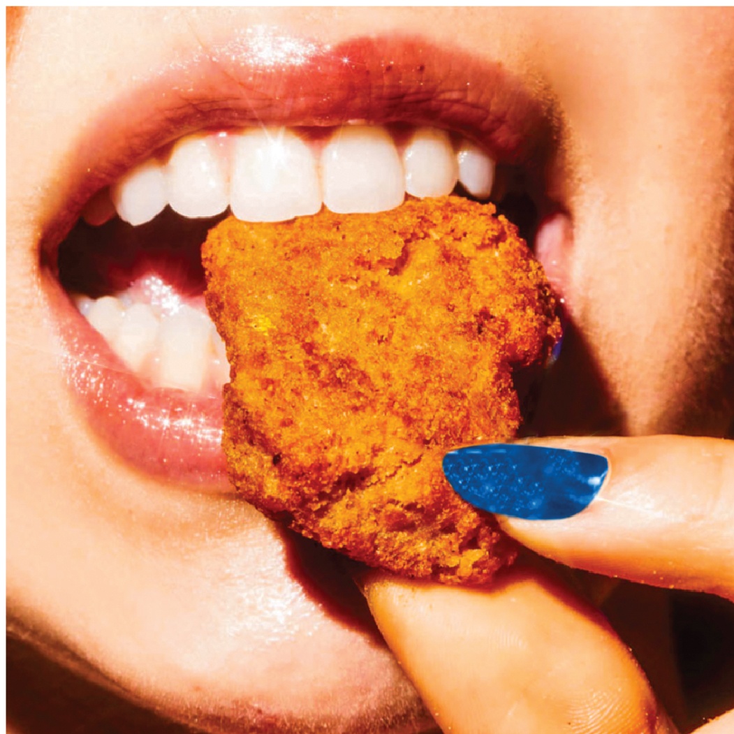 Closeup shot of person eating chicken nuggets