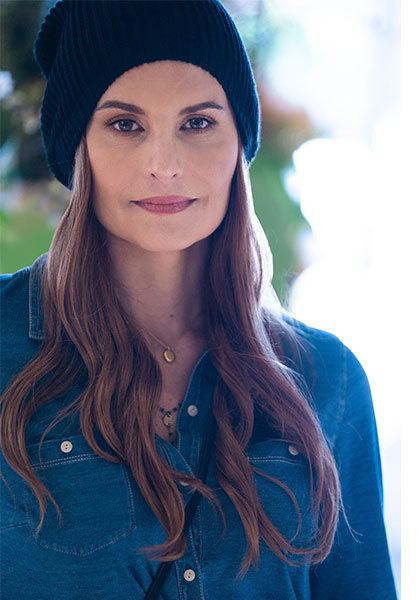 woman wearing black hat red hair