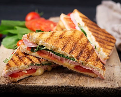 Nonstick griddle plate surface doubles as a panini press