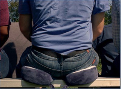man sitting on cement
