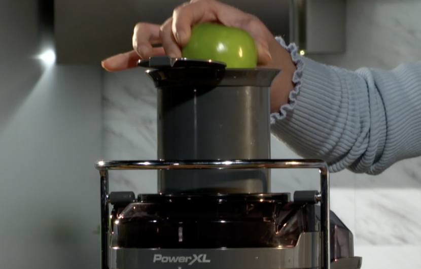 juicer with extra large chute - apple in chute