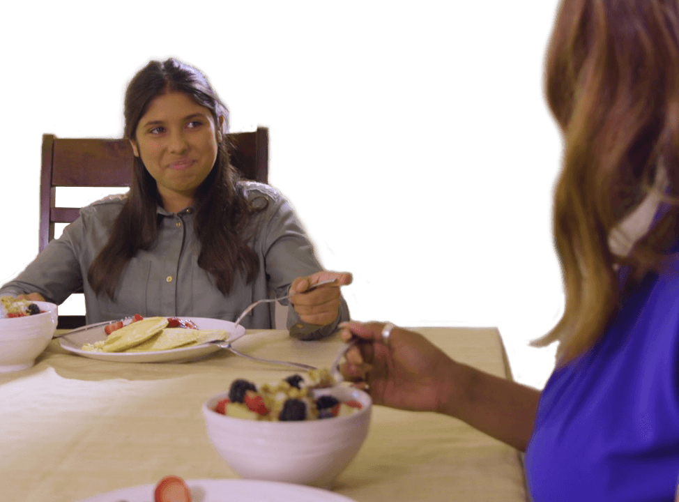 girl eating Grown American Superfood pancakes