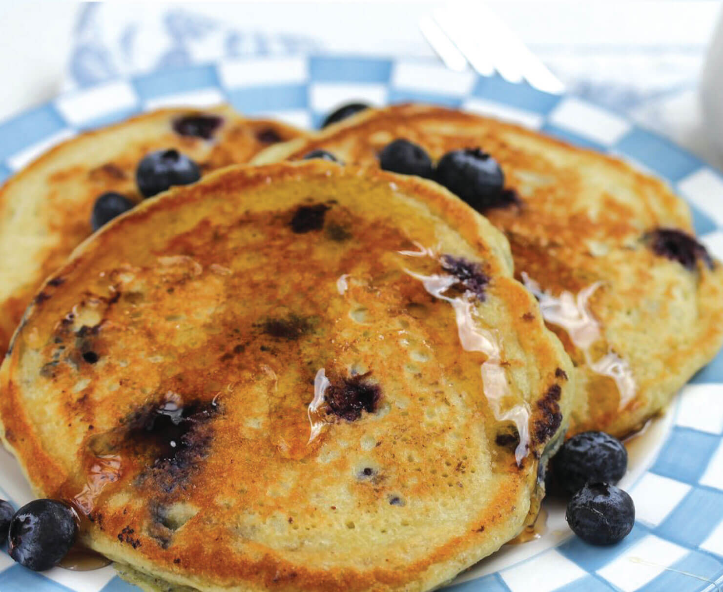 girl eating Grown American Superfood pancakes